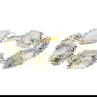 A green amethyst, diamond and silver bracelet: A green amethyst, diamond and silver braceletdesigned as a line of 7 octagonal step-cut prasiolite, framed by single-cut diamonds; estimated total diamond weight: 2.10 carats; 28.0 grams; length 7 in