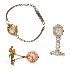 A group of metal watch objects