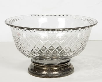 A European cut glass bowl with a sterling foot rim