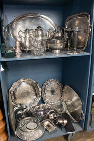 A large grouping of silverplate, including a pair Walker & Hall vases, (3) tea trays, a Leonard tea