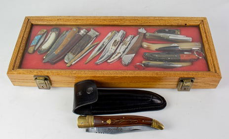 Fifteen French and Indo Asian folders in display case