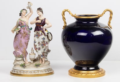 A Neoclassical style gilt bronze mounted cobalt porcelain urn and a German porcelain figural group