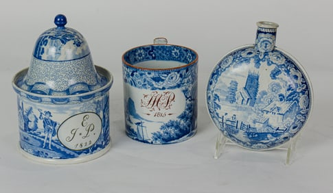 A Staffordshire blue and white transfer printed pilgrim flask, covered canister and mug