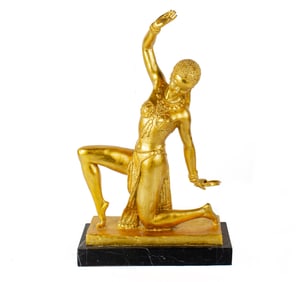 An Art Deco style gilt metal figure of a dancer after a model by Demetre Chiparus