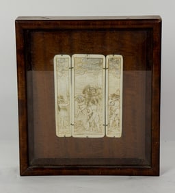 A Continental relief triptych with gilt and silvered highlights