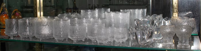 A group of Iittala Ultima juice and rocks glasses in the 'Ultima Thule' pattern designed by Tapio