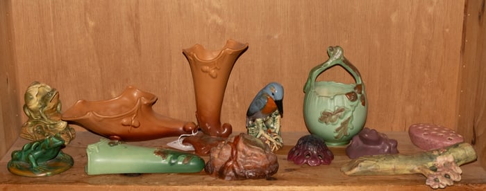 A group of twelve mainly Weller and other American pottery flower frogs and wall pockets