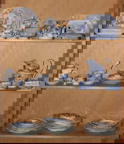 A large group of English transfer printed blue and white pottery