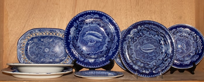 A group of English Staffordshire blue and white pottery plates decorated with seashells