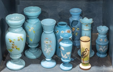 A group of seven turquoise opaline glass vases