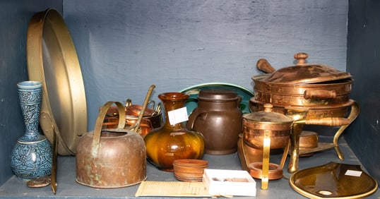 An assembled group of copperware and ceramics
