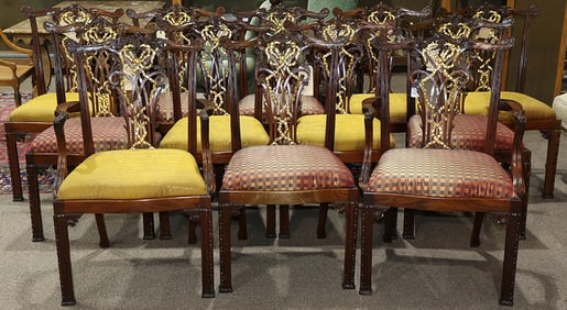 A suite of twelve Chippendale style dining chairs