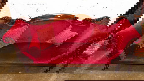 A contemporary mahogany Empire style sofa