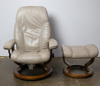 An Ekornes Stressless leather recliner and ottoman, recliner 37"h x 28"w