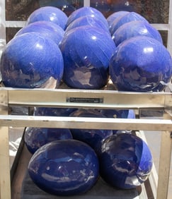 A group of seventeen glazed and incised ceramic ball ornaments
