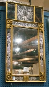 A Regency giltwood mirror with reverse engraved floral panels