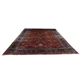 An antique Persian Meshed carpet