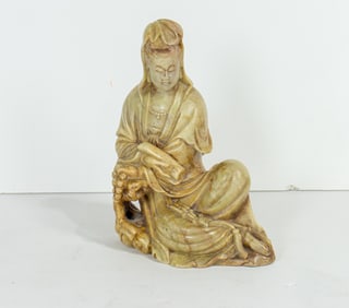 A Chinese soapstone carved figure of Guanyin