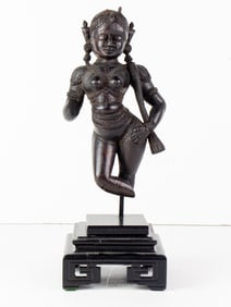 An Indian wood carved figures with stand