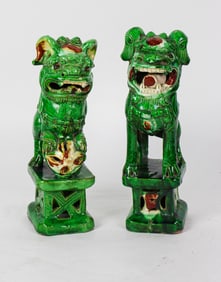 A pair of Chinese sancai glazed foo dogs