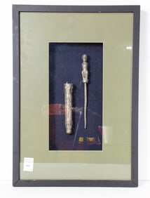 A figural beetlenut container in shadowbox frame, overall 23.5"h x 16.5"w