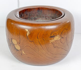 A Japanese inlaid wood hibachi brazier with copper line