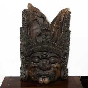 A large Balaniese carved wood mask of a guardian figure