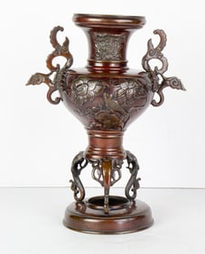 A Japanese bronze tripod censer