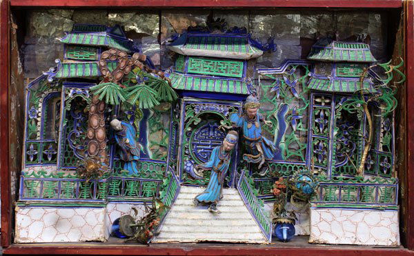 Chinese Mixed Media Diorama with Kingfisher Feathers: Chinese mixed media diorama, featuring a pavilion executed from pigment decorated paper, along with three features with robes accented with Kingfisher feathers, along with two bouquets of flower on bl