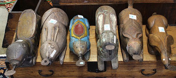 Six Thai Coconut Graters and Huskers: (lot of 6) Thai coconut wooden graters and huskers, consisting of four rabbits, one blue monkey with red and gilt painted seat and one tiger, longest: 20"l