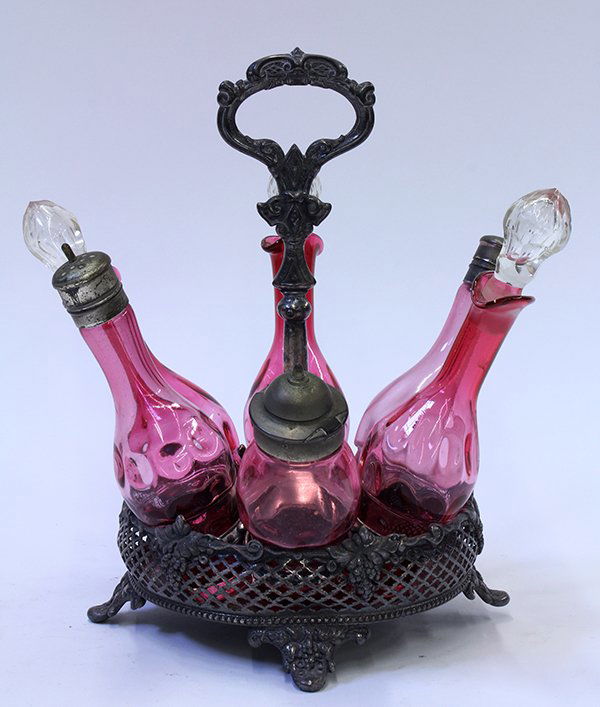 Six piece cranberry glass cruet set