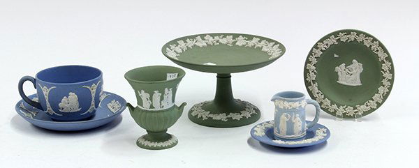 Wedgwood Jasperware green and blue table accessories: (lot of 7) Wedgwood Jasperware green and blue table accessories including compote, cup, saucer, miniature pitcher, cigarette urn, ashtray, and small tray, each piece decorated with a grape on vine mot