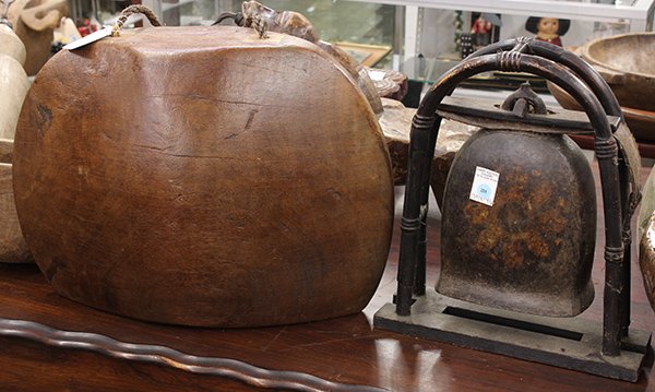 Southeast Asian temple bell: (lot of 2) Southeast Asian patinated metal temple bell, together with a teak bell having a rope handle and two clappers, largest: 16"h x 23"w