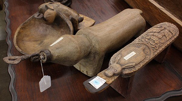 Thai carved figural coconut graters: (lot of 3) Thai carved figural coconut graters including a rabbit plank form with floral details, and a zoomorphic form with a stylized tortoise and rabbit, largest: 27"l