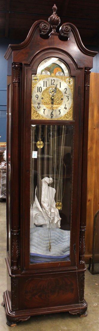 Herschede tall case clock model 294: Herschede tall case clock model 294, the mahogany case with a single bevelled glass door opening to the moon phase dial surmounting the nine tubes centered by the carved pilasters and rising on bracke