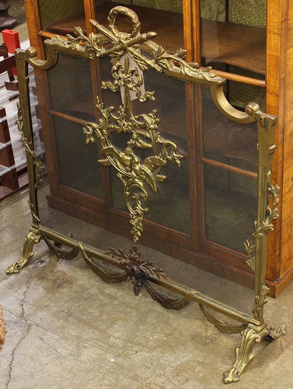 French style ornate gilt bronze firescreen: (lot of 3) French Roccoco style ornate brass firescreen having ribbon-tied shield and bird decoration, 28"h together with a pair of brass decorated andirons, 22.5"h