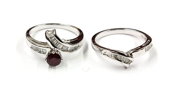 Lady's 14K white gold, ruby and diamond wedding ring se: Lady's ruby and diamond wedding ring set featuring one round mixed cut ruby, weighing approximately 0.54 carat, accented with baguette and tapered baguette cut diamonds; mounted in fourteen karat whit
