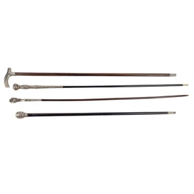 Four silver mounted walking canes or parasol handle