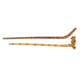 Two European walking canes carved with women