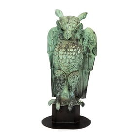 A verdigris patinated copper owl roof figure
