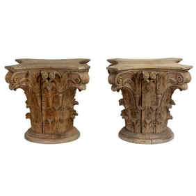 A pair of large Corinthian architectural capitals