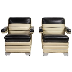 A pair of Art Deco lounge chairs with chrome details and later period correct black and white