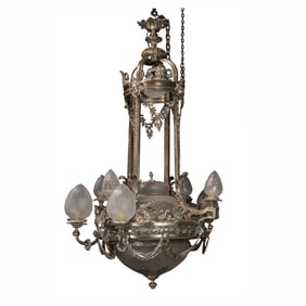 A fine and imposing Belle Epoque silvered bronze nine light chandelier