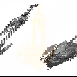 A fine and imposing Belle Epoque silvered bronze nine light chandelier