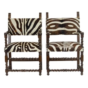 A pair of English oak armchairs