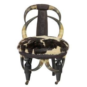 A Victorian horn slipper chair with hide upholstery