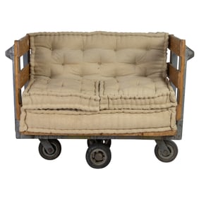 An industrial trolley converted to a loveseat