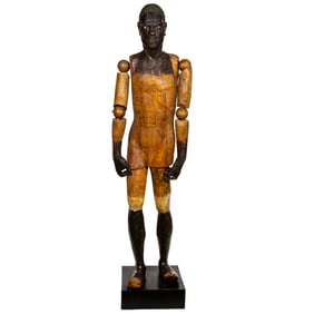 A life size Venetian Rococo carved polychrome blackamoor mannequin figure