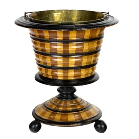 A European, possibly Dutch, parcel ebonized footed bucket with brass liner