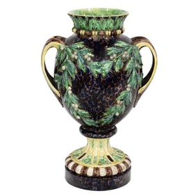 A large French majolica two-handled footed urn decorated with mistletoe in the Palissy palette